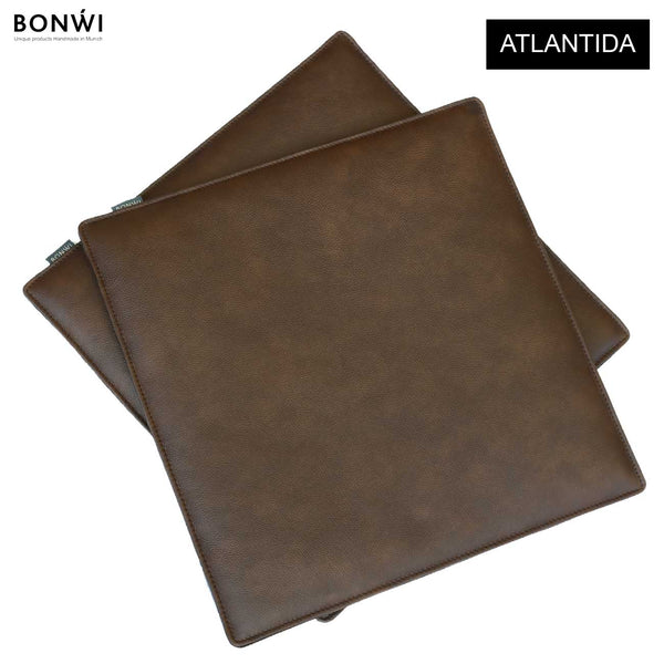  Zwei Bonwi Sitzkissen und Bankauflagen Atlantida aus Rindsleder in dunkelbraun.