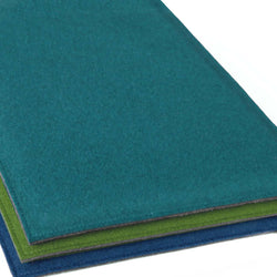 Sitzkissen aus Wollfilz nach Maß in türkis, grün und blau.